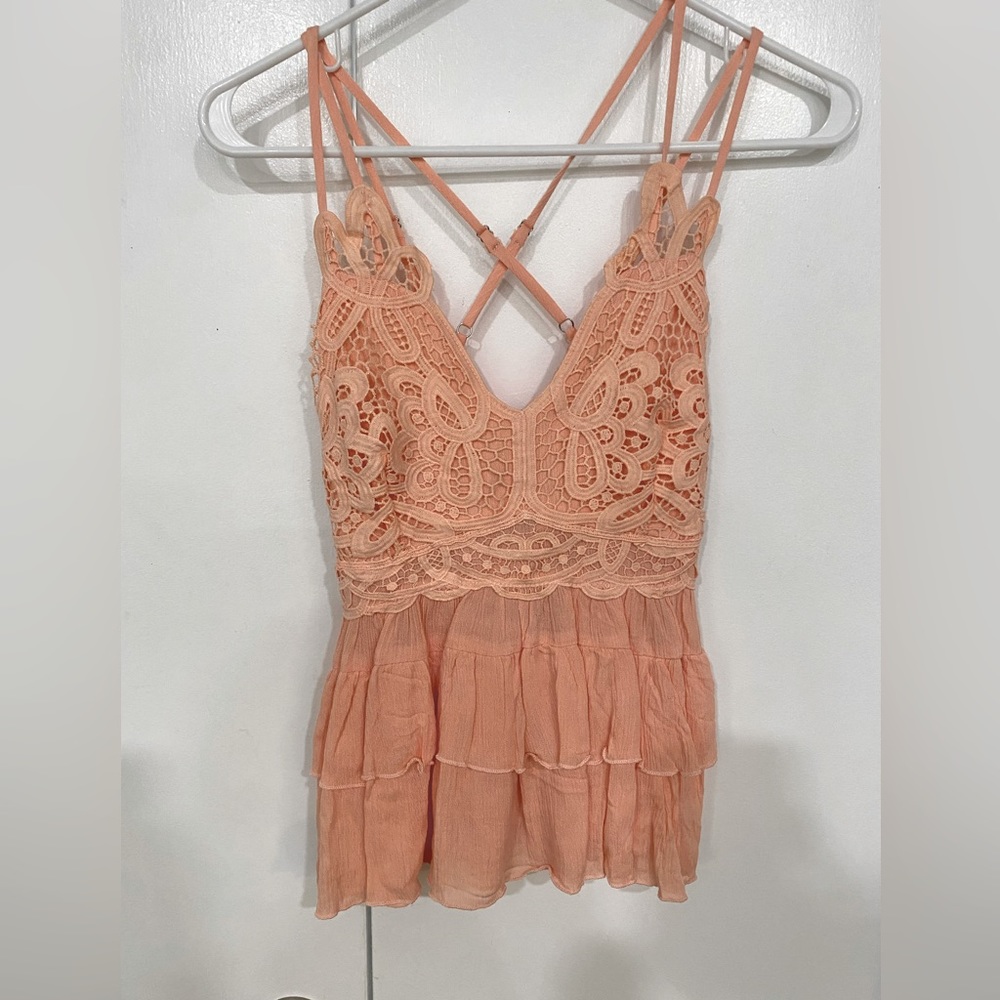 Cross cross peach peplum tank